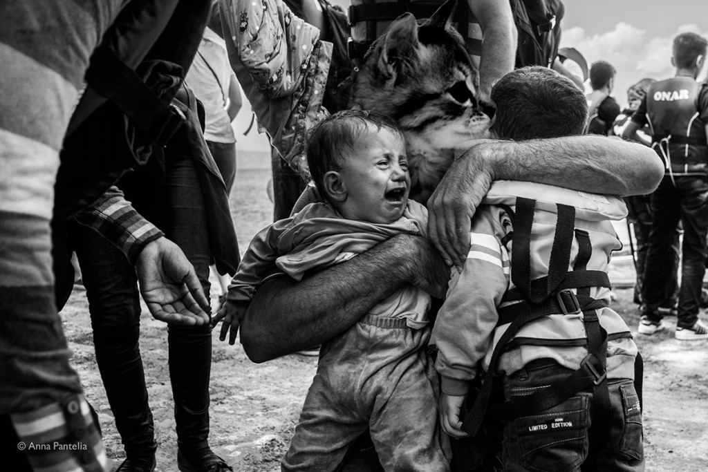 (no consent) A Syrian fathes with his 2 sons and his wife have just came out of the inflatable boat which took them to the Greek coast. Lesvos, Sept 8 2015