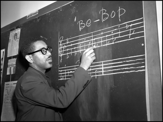 Trumpeter Dizzy Gillespie writes a phrase of "Be-Bop" music on the blackboard in New York, May 1, 1947.  (AP Photo)